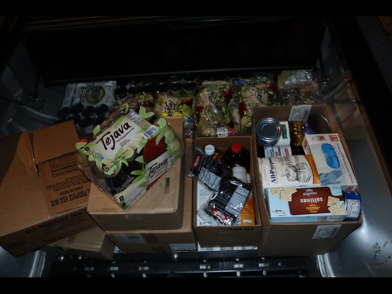 Various items boxed and exposed. Various boxes of foods to be delivered to Miwok Natives.