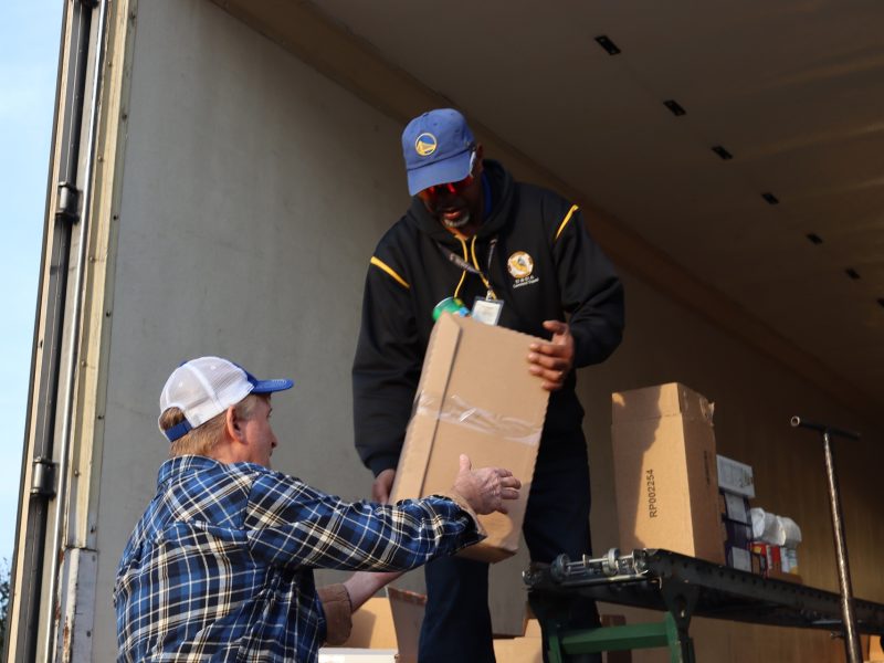 Finishing off one distribution Tribal staff helps Tule River Specialist Ronald Buckman. Ronald Buckman helping Tiger Paulk to unload goods for the Miwok tribe.