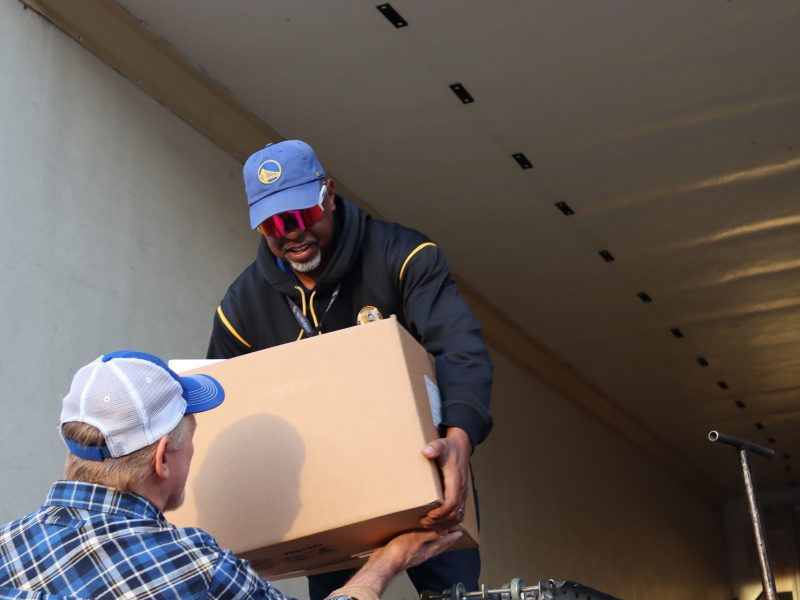 Tule River Specialist Ronald Buckman handing tribal staff last of a distribution. Ronald Buckman handing tribal staff the last box of goods of the December 2023 USDA food distribution.