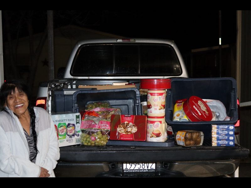 It was a great occasion as much was addressed in this delivery and the joy expressed by our very youthful looking Program Director, Mildred Burley (86) years young, highlighted this event making it all the more worth the effort. Miwok tribal elder Mildred Burley is standing in front of a truck filled with goods for tribal members.