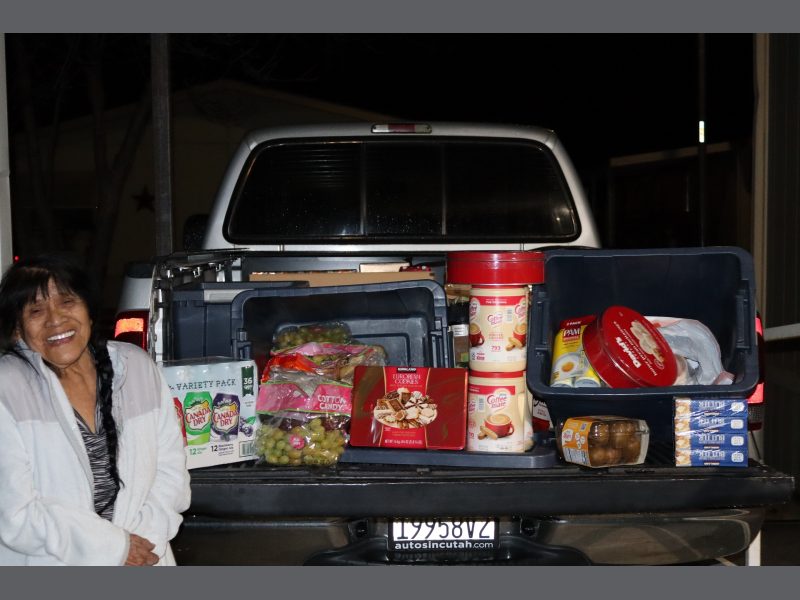 It was a great occasion as much was addressed in this delivery and the joy expressed by our very youthful looking Program Director, Mildred Burley (86) years young, highlighted this event making it all the more worth the effort. Miwok tribal elder Mildred Burley is standing in front of a truck filled with goods for tribal members.