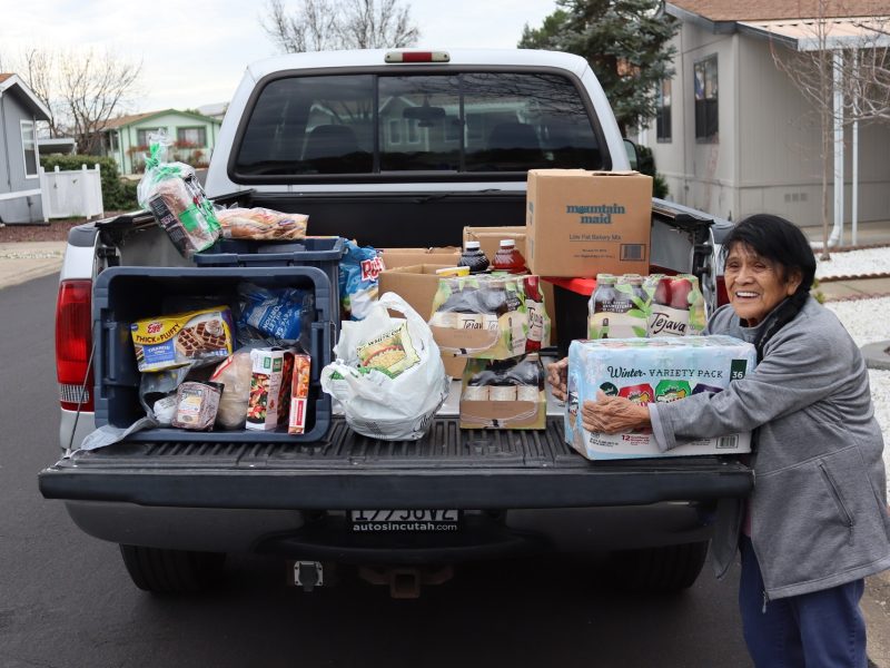 Program Director Mildred Burley grateful for the assistance she can give, seen with frozen meats / meals, vegetables, and additionally teas and a big pack of soda. California Valley Miwok Tribal elder Mildred Burley during the January 2024 Foor for Families Program distribution.