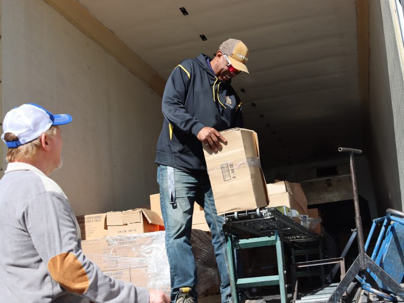 Beginning of the distribution as tribal staff waits for specialist Ronald Buckman. Specialist Ronald Buckman is unloading goods for the California Valley Miwok Tribe.