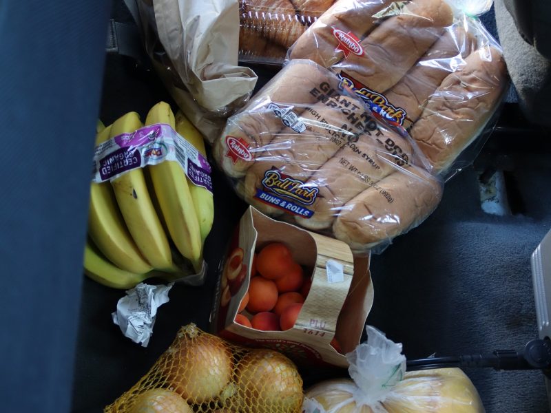 Various breads, fruits and vegetables.