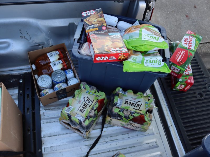 Massive overflowing tub of various meats and entrees along with canned goods and teas.