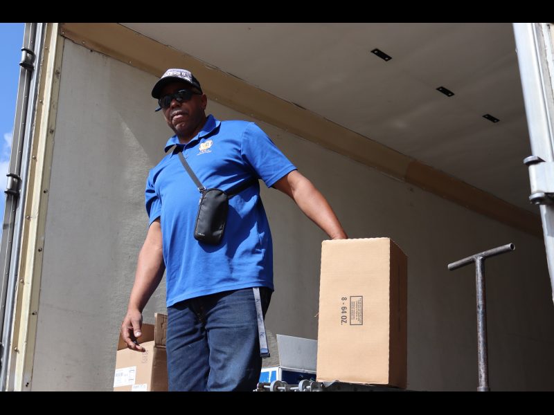 Ronald Buckman with the last box of the last distribution of the day. Ronald Buckman holding a box of goods to be delivered to tribal members during a USDA Food Distribution in September 2024.