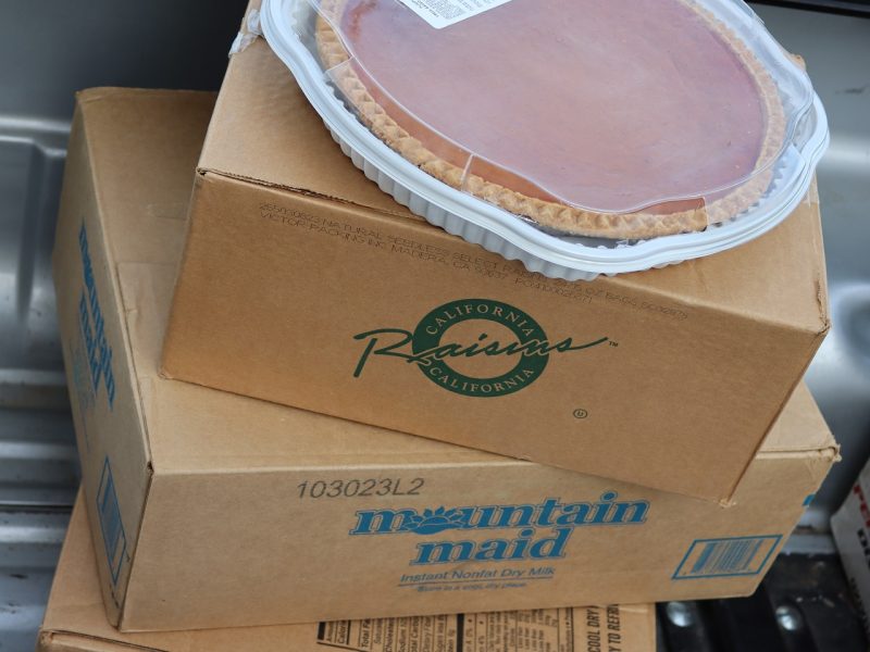 Boxes of various items and pie.