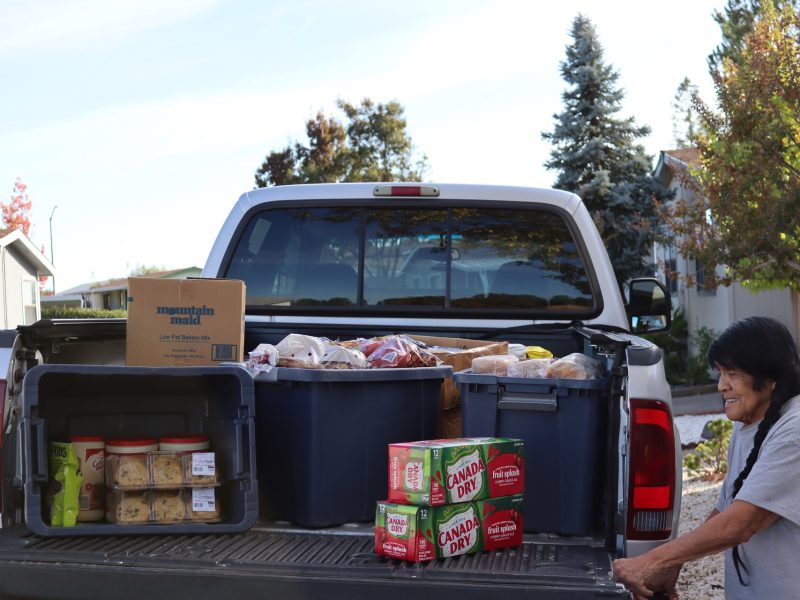 Program Director (Mildred Burley) with additional foods shown here. California Valley Miwok tribal elder Mildred Burley seen with truck full of goods during the FFTF distribution in October 2024.