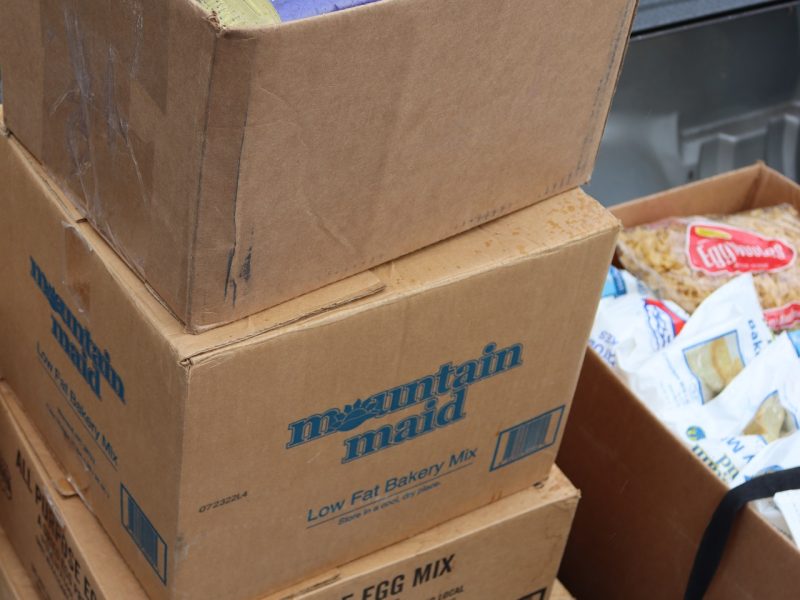 Boxes of various items and cooking oils.