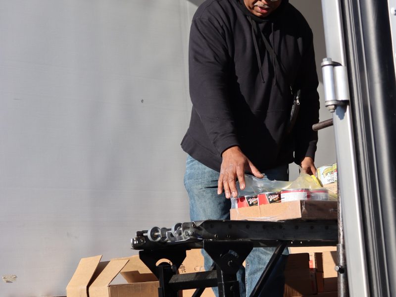 Assistant Director Ronald Buckman preparing another distribution.