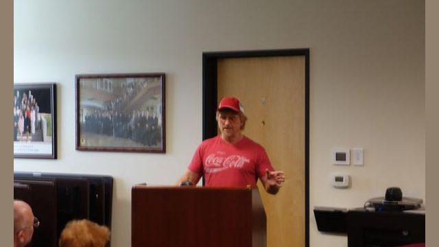 Tribal representative Tiger Paulk explains the history of the Tribe and of current events before introducing tribal members Mildred Burley and Michele Burley.
