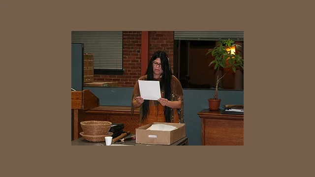 Chairperson Burley dressed in regalia, reading aloud one of the many poems she authored and brought on this day. Of the hand-outs brought for attendees, none were left to take back to the tribal offices.